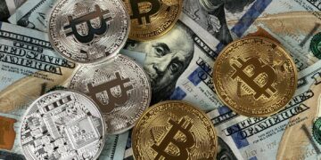 Close-up of bitcoins and US dollar bills symbolizing modern finance and cryptocurrency.